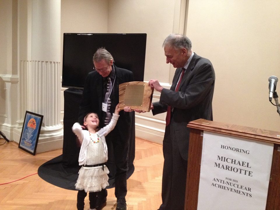 Michael Mariotte and daughter Zoryana receive lifetime achievement award from Ralph Nader, November 10, 2014.